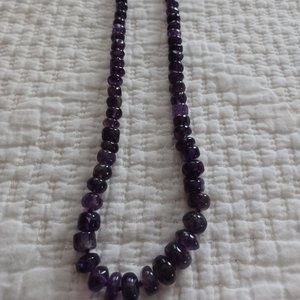 Varied sized  purple colored stone necklace